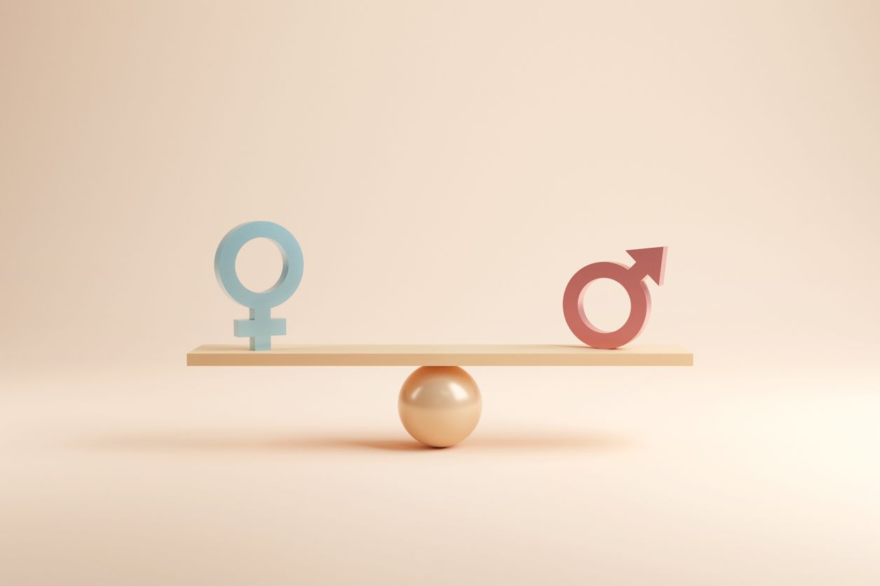 symbole kobiet i mężczyzn na równoważni